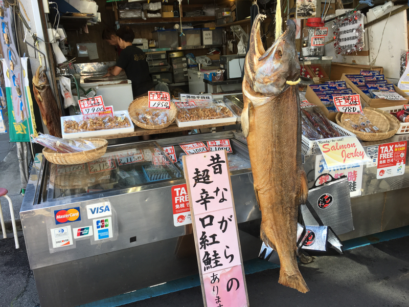 An outer market stall selling dried fish products.